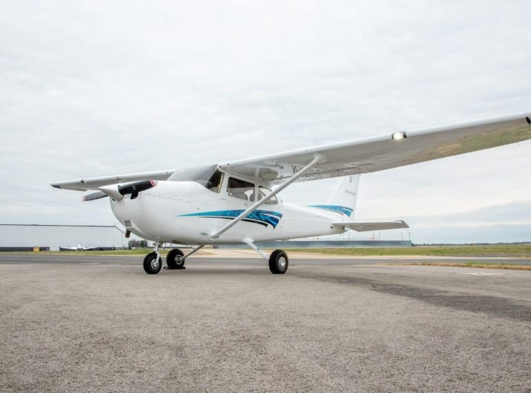 A Cessna 172 parked on the apron