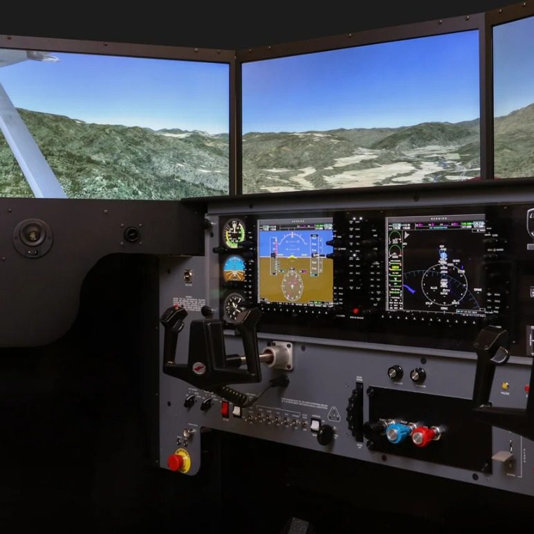 Instrument panel set against the simulator's wrap-around visual system