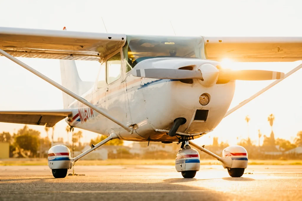 A Cessna 172 parked on an airport tarmac